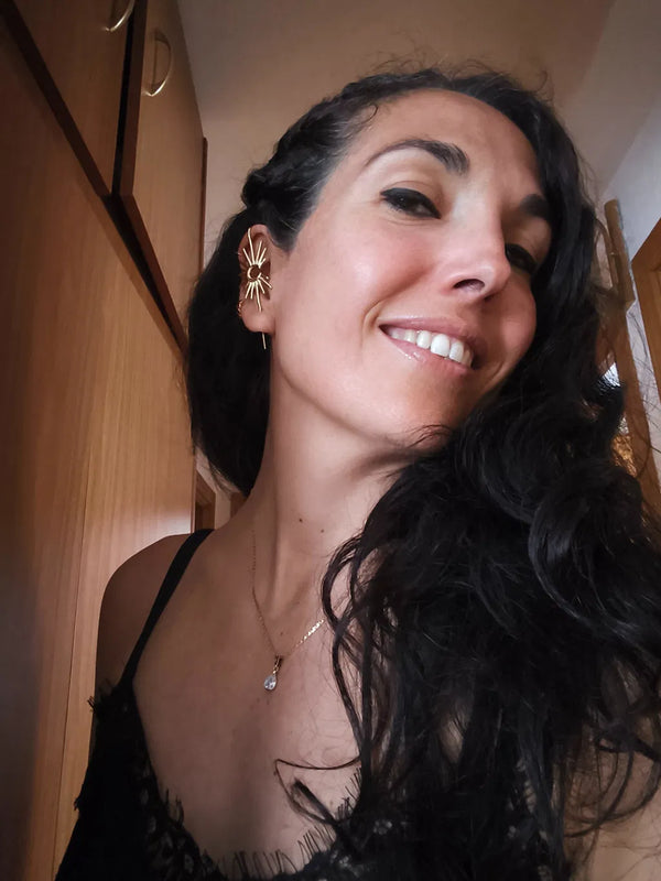 An Oreylo customer wearing their earrings