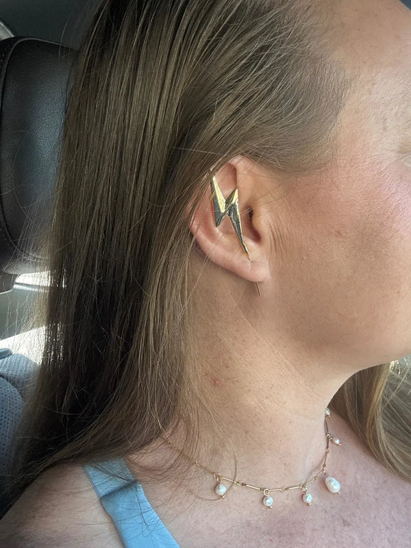 An Oreylo customer wearing their earrings