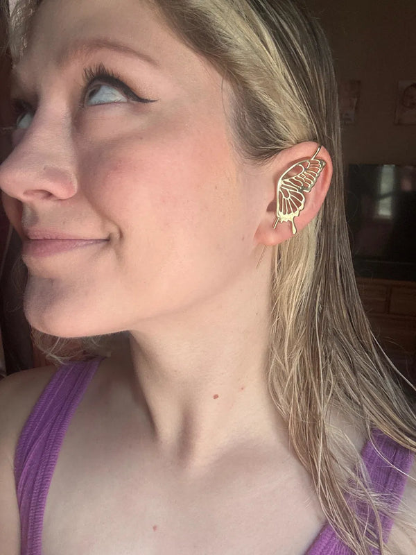 An Oreylo customer wearing their earrings